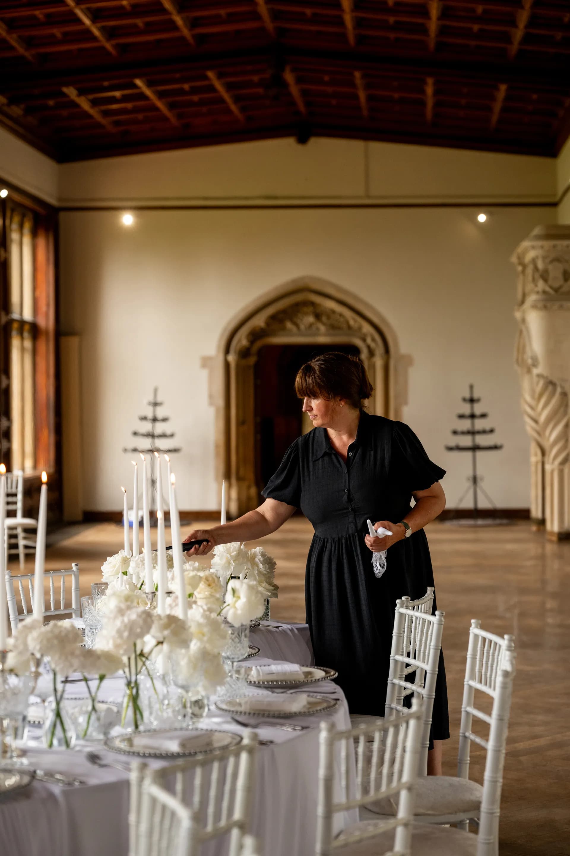 Our coordinator dressing the tables in the Music Room