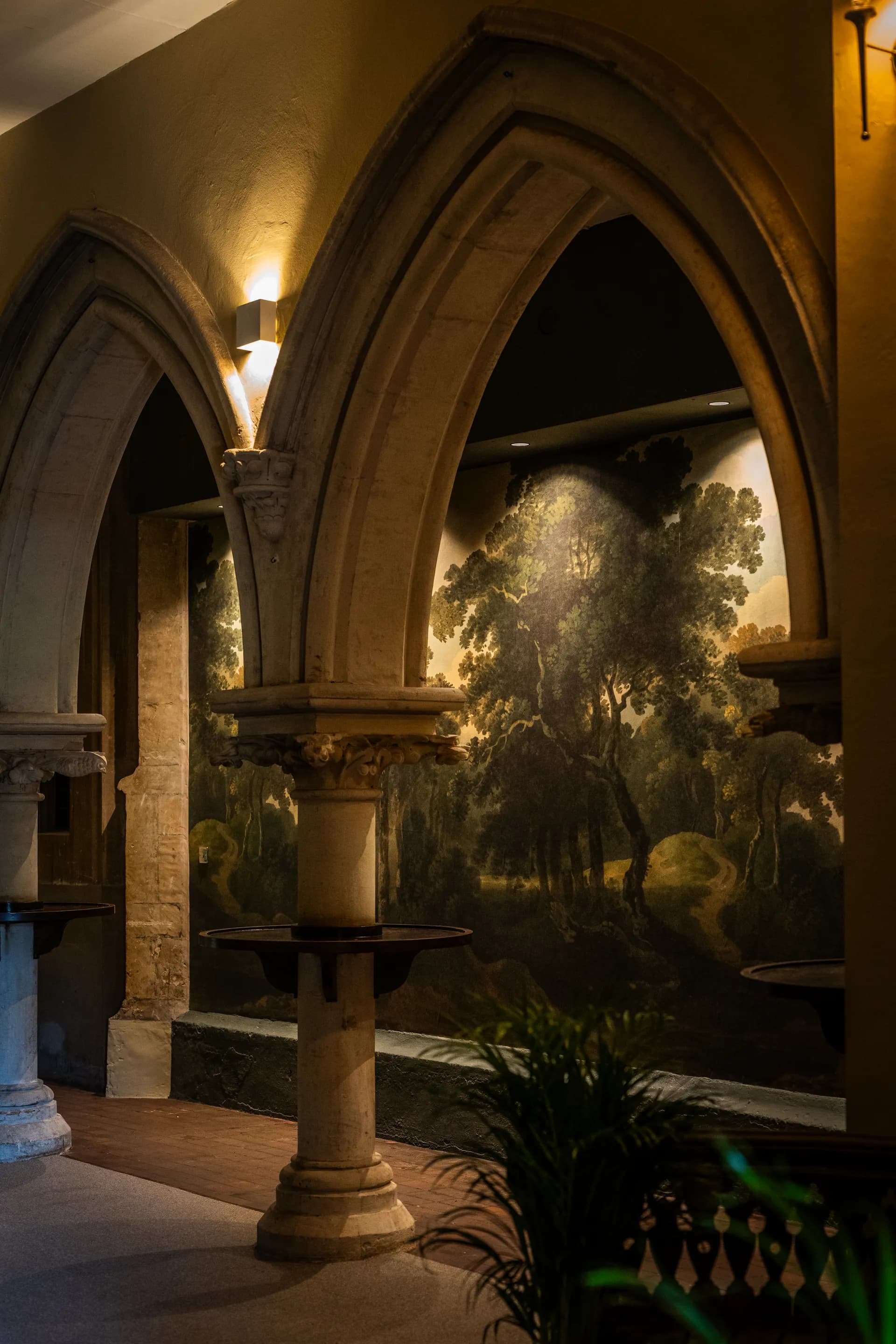Vaulted room with a painted landscape mural